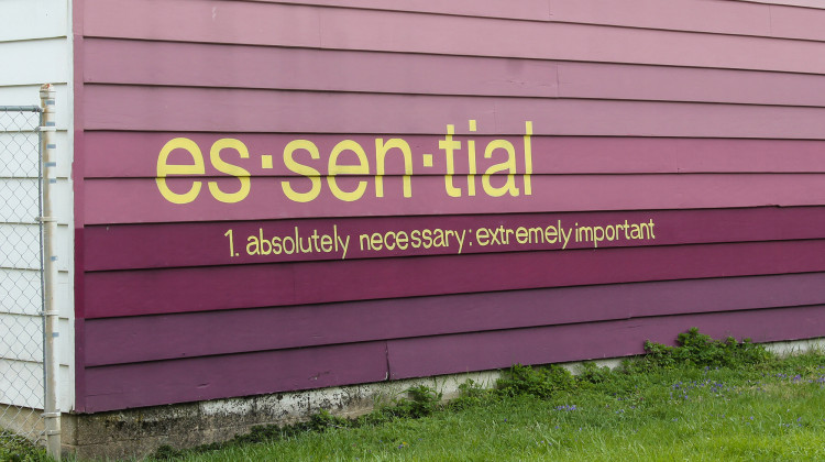 Along the Monon Trail in Indianapolis, a mural reads: "essential. 1. absolutely necesssary, extremely important." - Lauren Chapman/IPB News