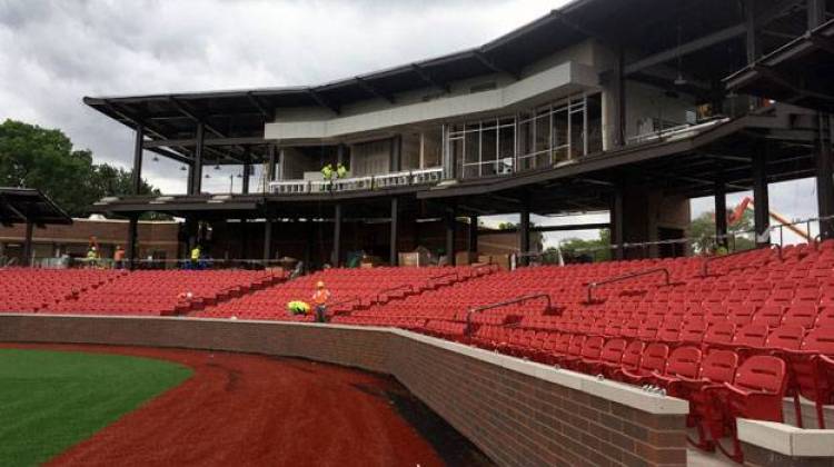 Workers install seats just four days before opening night. - Joe Hren