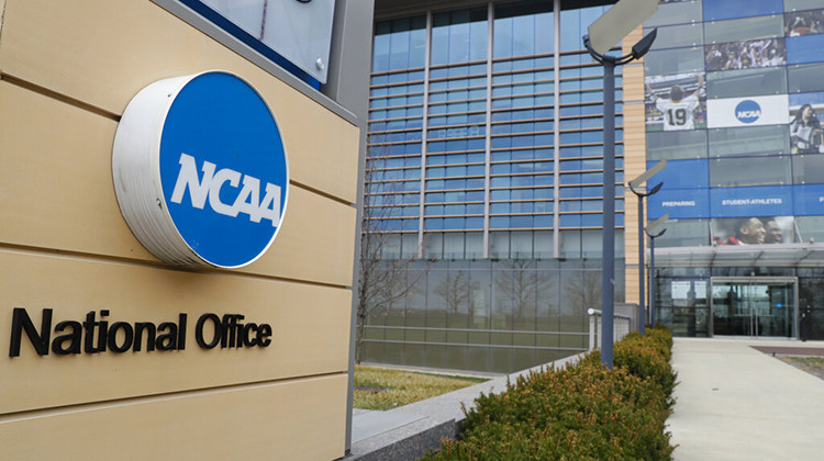FILE - This is a March 12, 2020, file photo showing NCAA headquarters in Indianapolis. The NCAA Board of Governors called for a special constitutional convention in November to initiate dramatic reform in the governance of college sports that could be in place as soon as January. - AP Photo/Michael Conroy, File