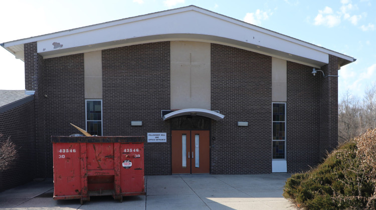 Before the all-girls charter school Girls IN STEM Academy can open in the former Witherspoon Presbyterian Church at 5136 Michigan Road a rezoning request must be approved by city-county officials. A dumpster sits outside a door of the building on Sunday, February 25, 2023. - Eric Weddle / WFYI