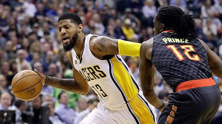 Indiana Pacers' Paul George goes to the basket against Atlanta Hawks' Taurean Prince during the first half of Wednesday night's game. - AP Photo/Darron Cummins