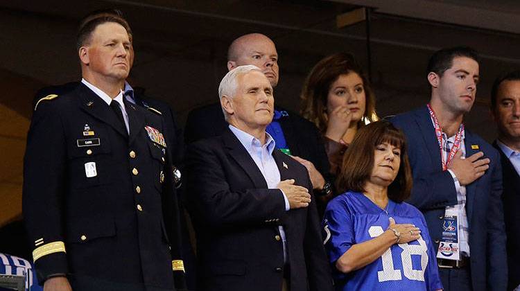 Vice President Mike Pence, front center, stands during the playing of the national anthem before an NFL football game between the Indianapolis Colts and the San Francisco 49ers, Sunday, Oct. 8, 2017, in Indianapolis. - AP Photo/Michael Conroy