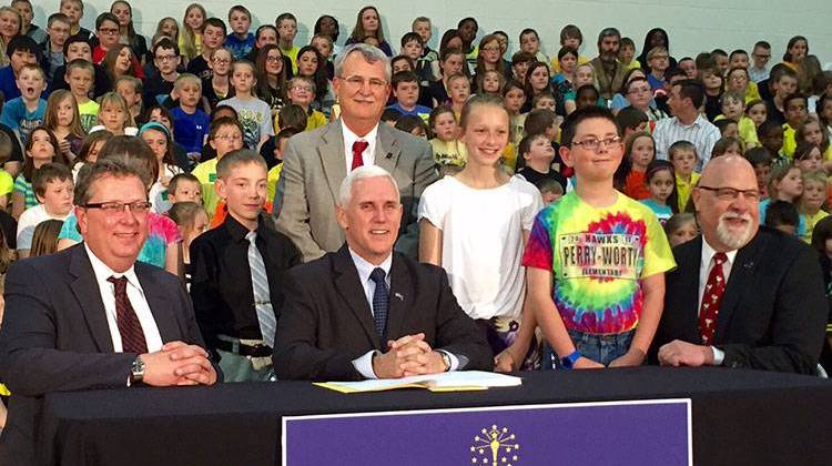 From L to R: Sen. Brandt Hershman,R-Buck Creek; Rep. Mike Karickhoff, R-Kokomo; Gov. Mike Pence; and Rep. Tim Brown,R-Crawfordsville with students at Perry-Worth Elementary in Lebanon. - Brandon Smith