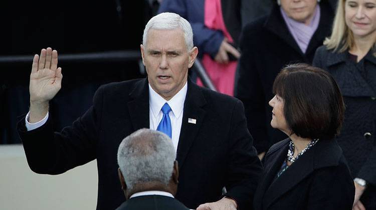 Vice President Mike Pence takes his oatch of office during the 58th Presidential Inauguration at the U.S. Capitol in Washington, Friday, Jan. 20, 2017. At his right is his wife Karen. -  AP Photo/Matt Rourke