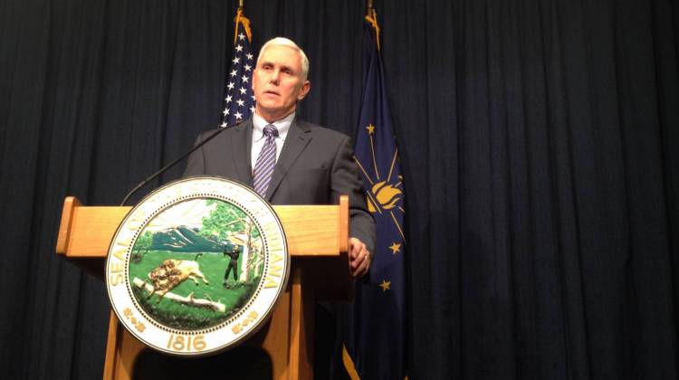 Gov. Mike Pence pledges to reduce the 2015 ISTEP test with the help of State Superintendent Glenda Ritz on Wednesday, Feb. 11, 2015 at the Statehouse. - Eric Weddle / WFYI Public Media