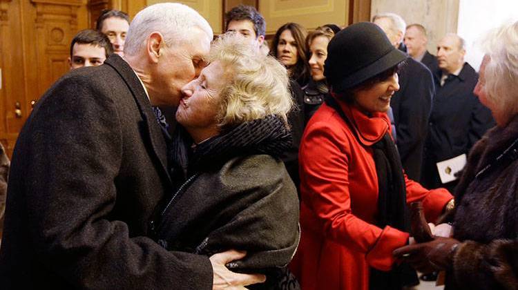 Indiana Gov. Mike Pence hugs his mother, Nancy Pence Fritsch, after being sworn in as Indiana's 50th governor on Jan. 14, 2013. - AP Photo/Darron Cummings