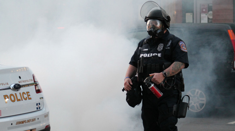 After firing tear gas canisters into the crowd Saturday night, IMPD officers began spraying pepper spray in the area. - Lauren Chapman/IPB News