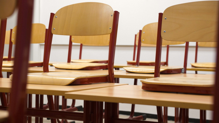 Empty chairs in a classroom.  - Pexels