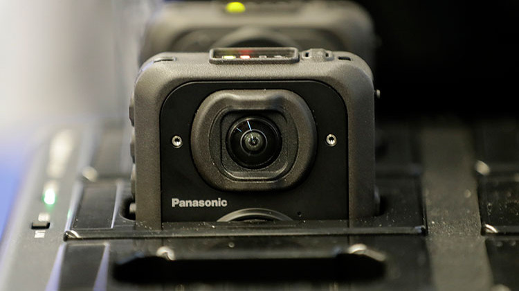 Body cameras are seen on a dock station during a news conference at the Panasonic headquarters unveiling cameras for Newark Police officers, in April 2017. - AP Photo/Julio Cortez