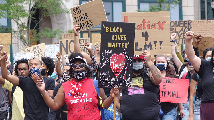 A rally organized by the Indiana Racial Justice Alliance drew several hundred people to Monument Circle on Saturday, June 13, 2020. The group wants the city to reduce the budget of IMPD and reinvest the funds in new community-led initiatives.  - Eric Weddle/WFYI