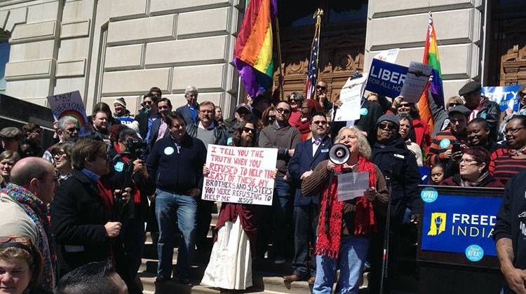 Protesters gather on the steps of the Statehouse during a rally Saturday. - Michelle Johnson
