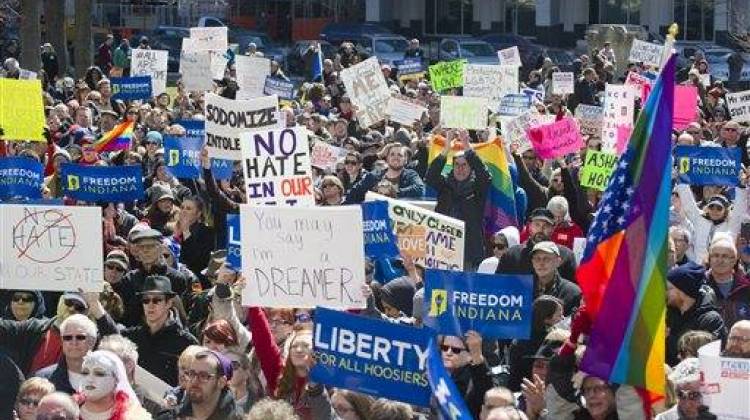 Opponents of Indiana's "religious freedom" legislation rally outside the Statehouse, Saturday, March 28, 2015. - Associated Press file photo