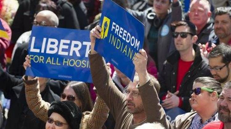 Thousands of opponents of Indiana Senate Bill 101, the Religious Freedom Restoration Act, gathered on the lawn of the Indiana State House to rally against that legislation Saturday, March 28, 2015.  - The Associated Press