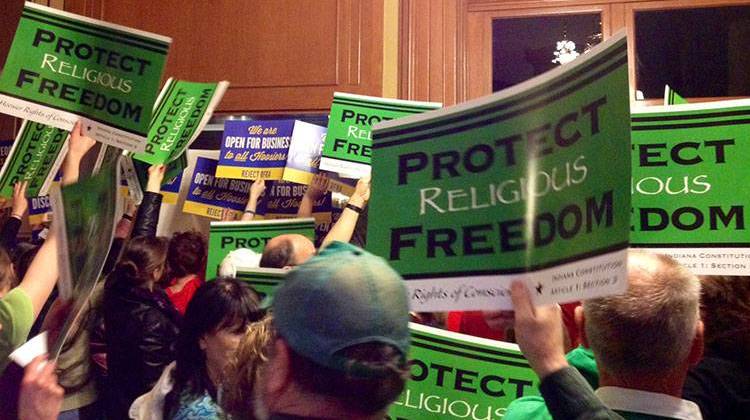Opponents and supporters of the RFRA rally outside the House chamber. - Brandon Smith