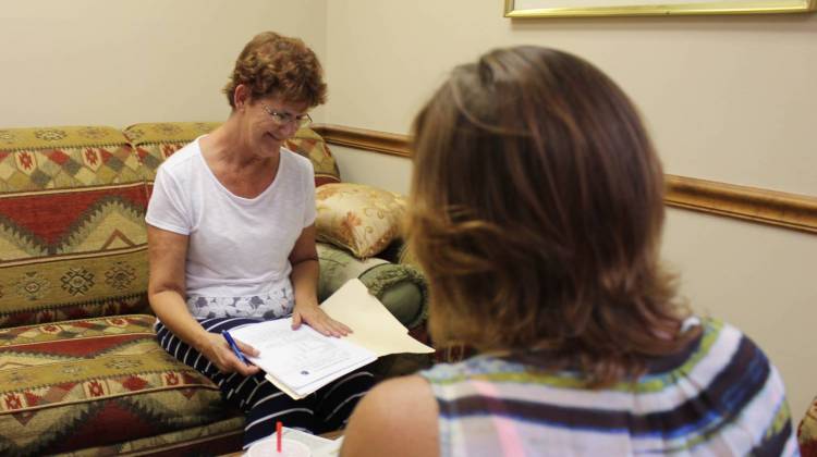 Peer support sepcialist Sally Moore (left) gives a needs assessment to Deana Kilpatrick at PEEPs in Recovery in Reeds Spring, Missouri. - Bram Sable-Smith/ KBIA/Side Effects Public Media