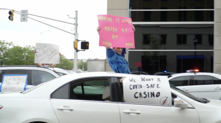 Casino workers hold signs from their cars in downtown Indianapolis. - Alan Mbathi/IPB News