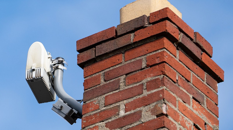 A ShotSpotter sensor mounted to a chimney Thursday, March 21, 2024, on the east side of Indianapolis. - Jenna Watson / Mirror Indy