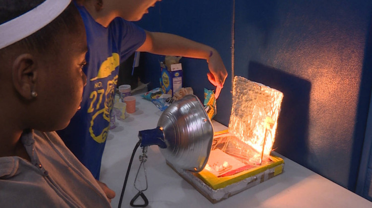 Seventh graders Tamyah Conner (left) and Bella Rollins (right) of Center for Inquiry School 27 in Indianapolis made a solar oven for the school's climate fair in 2019. - Rebecca Thiele/IPB News
