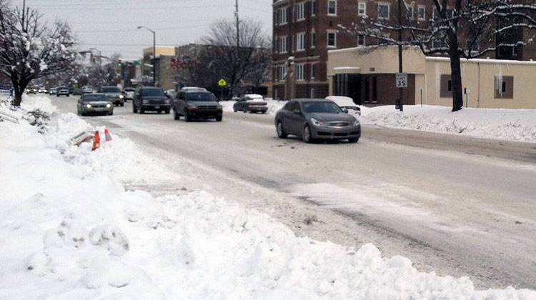 Traffic moves along Meridian Street in downtown Indianapolis after a snowstorm in early 2014. - Doug Jaggers