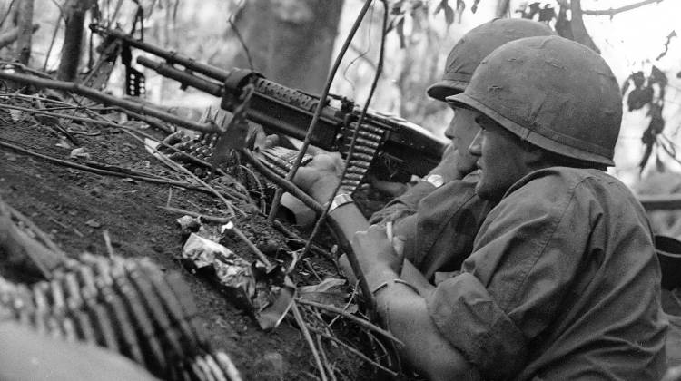 Soldiers provide covering fire with a M60 machinegun in 1966. - U.S. Army
