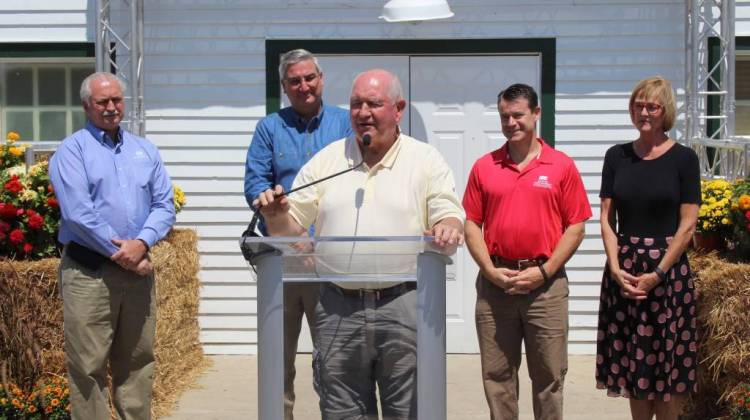 U.S. Secretary of Agriculture Sonny Perdue speaks alongside Indiana Farm Bureau President Randy Kron, Gov. Eric Holcomb, Sen. Todd Young (R-Ind.) and Lt. Gov. Suzanne Crouch at the Indiana State Fair. - Annie Ropeik/IPB
