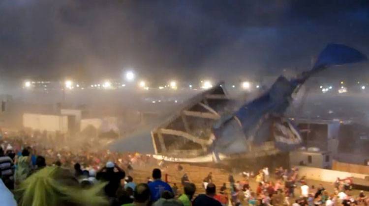 In this Aug. 13, 2011 file frame grab from video provided by Jessica Silas, a stage collapses at the Indiana State Fair in Indianapolis killing seven and injuring dozens of fans waiting for the country band Sugarland to perform. - AP Photo/Jessica Silas, File