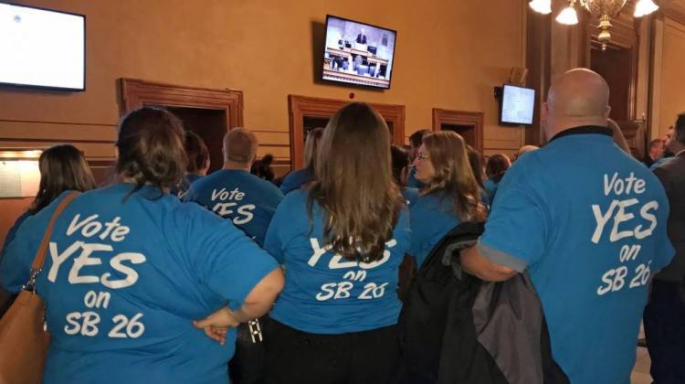 Supporters of the cold beer expansion bill stand outside the Indiana Senate Chamber to watch the committee hearing. - Brandon Smith/IPB News