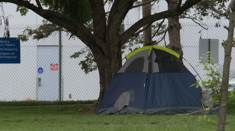 A police officer walked through Seminary Park informing people that tents would no longer be allowed.  - Devan Ridgway, WTIU News