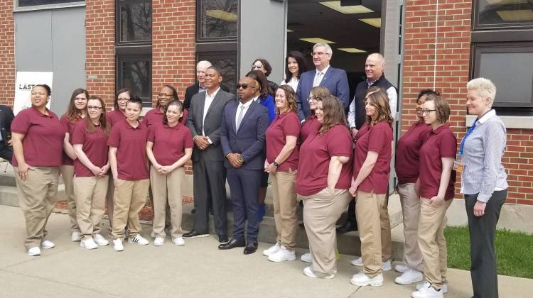 The inaugural class gets a picture with MC Hammer, Gov. Eric Holcomb and others to commemorate the day.  - (Samantha Horton/IPB News)