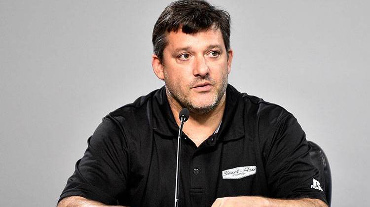 NASCAR auto racing driver Tony Stewart reads a statement during a news conference at Atlanta Motor Speedway in Hampton, Ga., on Friday, Aug. 29. - AP Photo/John Bazemore