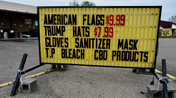 A store in Liberty, Indiana, advertises selling American flags, Trump hats and coronavirus cleaning supplies.  - Justin Hicks/IPB News
