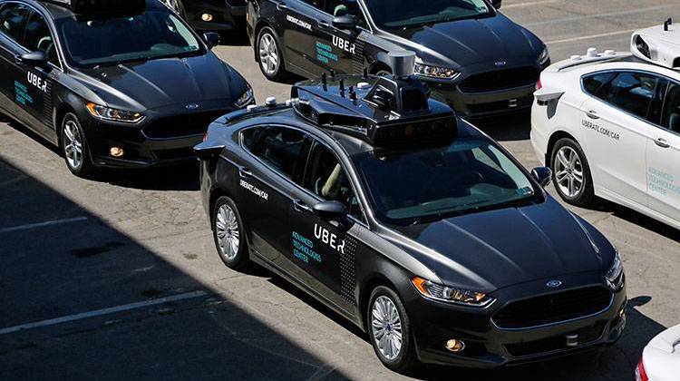 FILE- This Sept. 12, 2016, file photo, shows group of self driving Uber vehicles position themselves to take journalists on rides during a media preview at Uber's Advanced Technologies Center in Pittsburgh.  - AP Photo/Gene J. Puskar, File