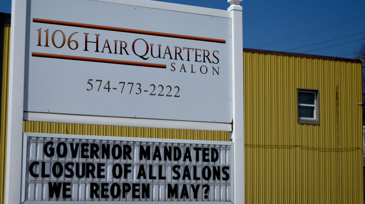 A hair salon in Nappanee displays a closure sign in April 2020 related to Gov. Eric Holcomb's COVID-19 executive orders. - Justin Hicks/IPB News