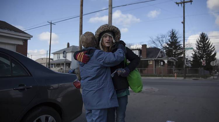 Sister Nadine of the Sisters devotion embraces one of the many women she helps in the Hilltop area of Columbus,Ohio. - Seth Herald/Side Effects Public Media