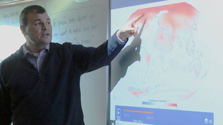 Centerville-Abington Junior High teacher Keith Morey shows his students an animated map from NASA that looks at how average temperatures have changed since the late 1800s. Many teachers we talked to say NASA's website is one of the few places they can go to find quality climate change info that's easy for their students to understand. 
