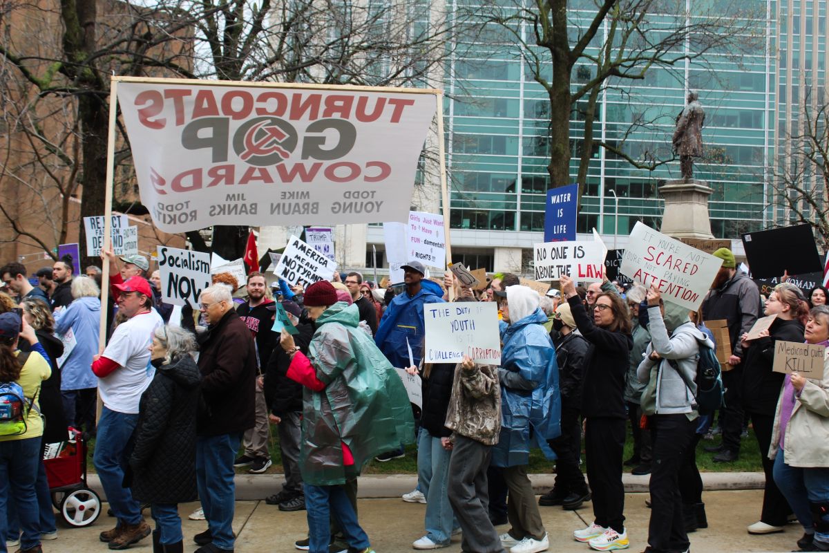 Protestors marched around the Indiana Statehouse holding signs saying “No one is above the law” and “Dump Trump” at the Hands Off! rally on Saturday, March 5. Many protestors cited their anger over the Trump administration’s targeting of government agencies, diversity, LGBTQ rights and immigration.