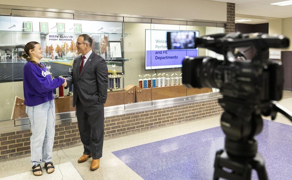 Hannah Waltermire, 17 (left), records a segment for Ben Davis Television with Wayne Township Superintendent Jeff Butts on Aug. 5, 2025, at Ben Davis High School in Indianapolis.