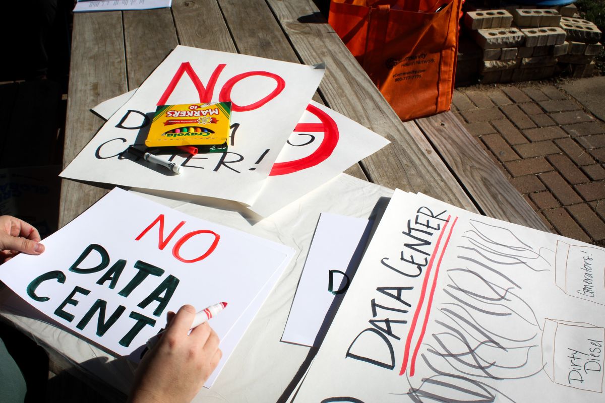 Martindale-Brightwood residents make signs protesting the proposed data center at a press conference on Monday, Nov. 17, 2025.