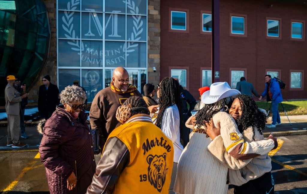Martin University alumna Stacy Tolliver hugs Dorthy Herron after a press conference Dec. 17, 2025, at Martin University in Indianapolis. “This school changed my life,” Tolliver said.