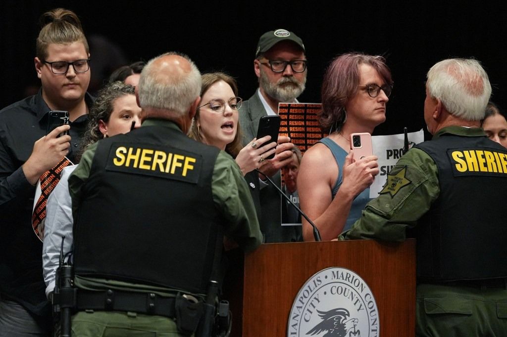 Lauren Roberts speaks as she is forced to leave by sheriff’s deputies.