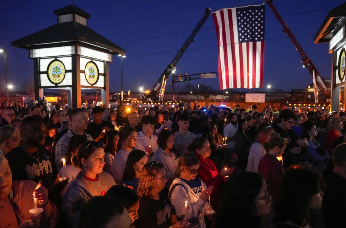Residents gather on Wednesday, Feb. 18, 2026, outside of the Beech Grove Police Station on Main Street in Beech Grove. City leaders, residents and members of law enforcement held a candlelight vigil to honor Brian Elliott, who was killed in the line of duty Feb. 16.