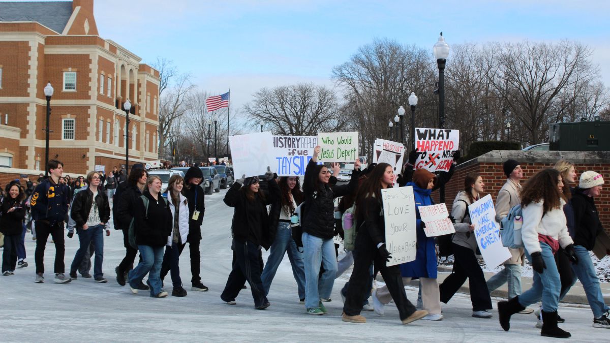 Carmel High School students walk towards City Hall on the afternoon of Tuesday, Jan. 20, 2026, protesting the Trump administration. 