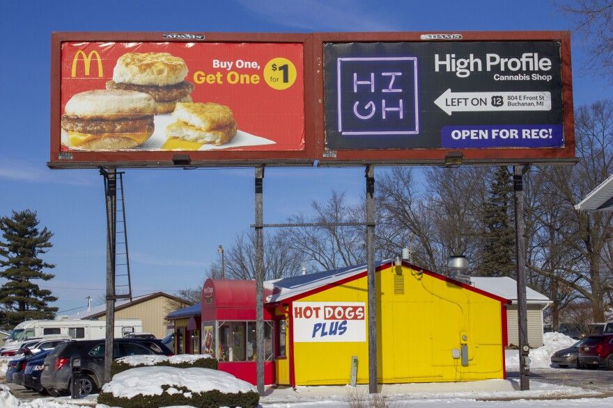A billboard advertising High Profile Cannabis Shop, a dispensary located in Buchanan, Michigan. The billboard is in Niles, Michigan, about 4 miles north — but on the same highway — of the Indiana billboard for Green Stem Provisioning.