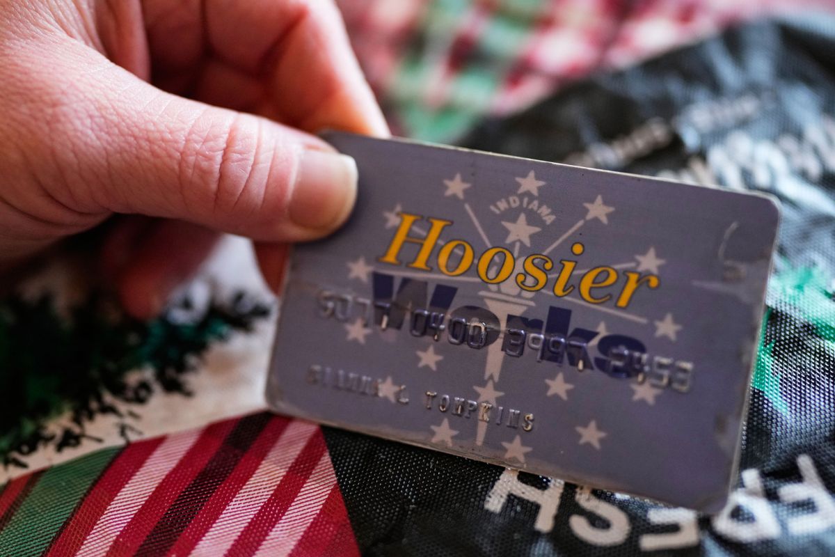 Dianna Tompkins holds a her SNAP card at home in Demotte, Wednesday Dec. 17, 2025.