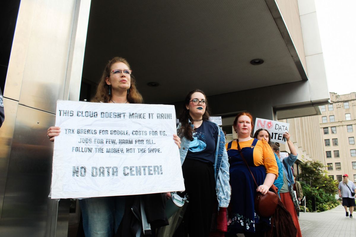 Protestors outside the Indianapolis City-County building on Monday, Sept. 22, 2025 hold signs in opposition to Google’s data center campus proposal in Franklin Township. 