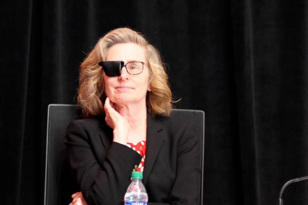 Whitten at the June 2024 Board of Trustees meeting after her eye surgery.