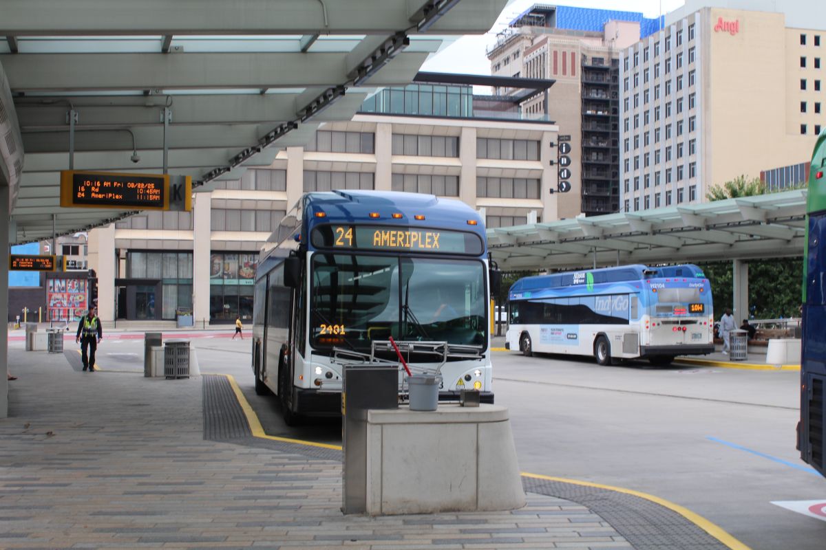 An IndyGo bus waiting at the transit station.