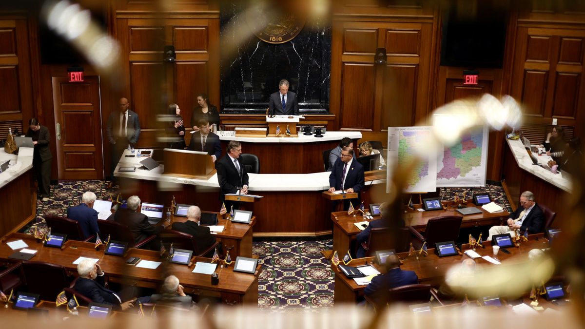 Redistricting bill sponsor Rep. Bill Smaltz (R-Auburn) speaks to Rep. Mike Andrade (D-Munster) before the final vote in the House chamber of the statehouse on Friday, Dec. 5, 2025.