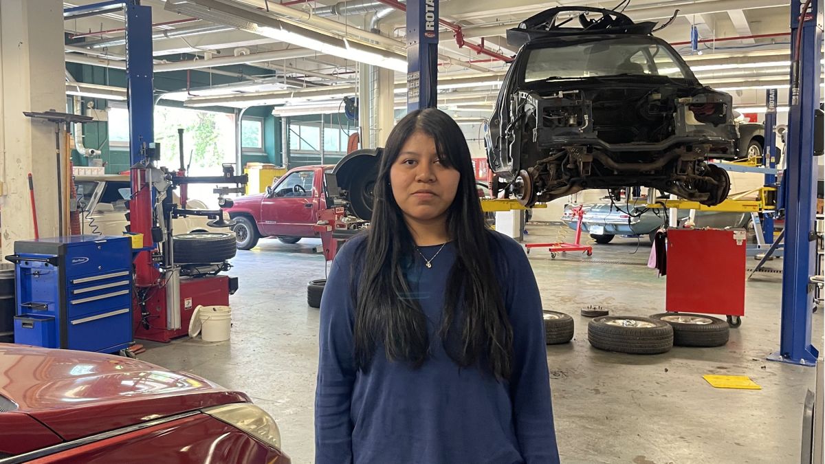 Daisy Belli-Gerardo stands in the Arsenal Tech High Schools's automotive shop on Wednesday, May 14, 2025. The 2025 graduate said she learned important skills there that she will take to a career that does not include mechanics.