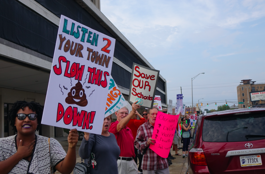 Protestors stand outside Indianapolis Public Schools administration office, on Tuesday, June 27, 2017, to call for more community input on unreleased plan to close multiple high schools in 2018. | By Eric Weddle/WFYI News